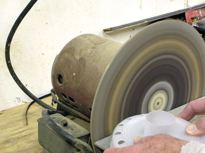Remove the Dust Muzzle from the Grinder and remove the unnecessary part of the Dust Muzzle skirt with a stationary grinder or belt sander using 60 grit paper.